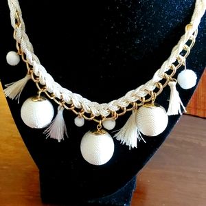 Kept goldtone and cord statement necklace with tassle and bead charms